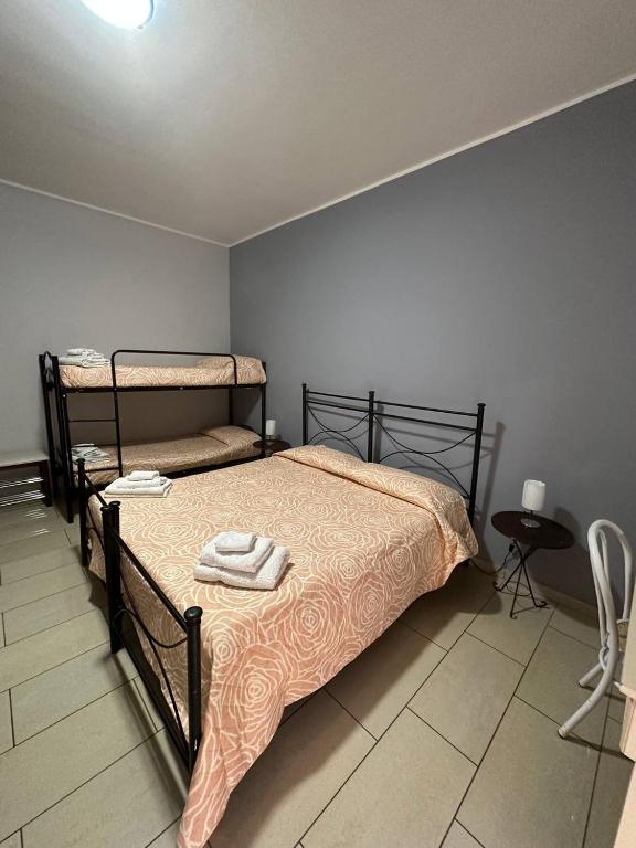 Postel nebo postele na pokoji v ubytování B&B Emmanuel