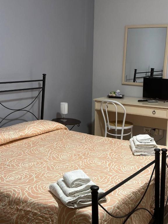 Postel nebo postele na pokoji v ubytování B&B Emmanuel