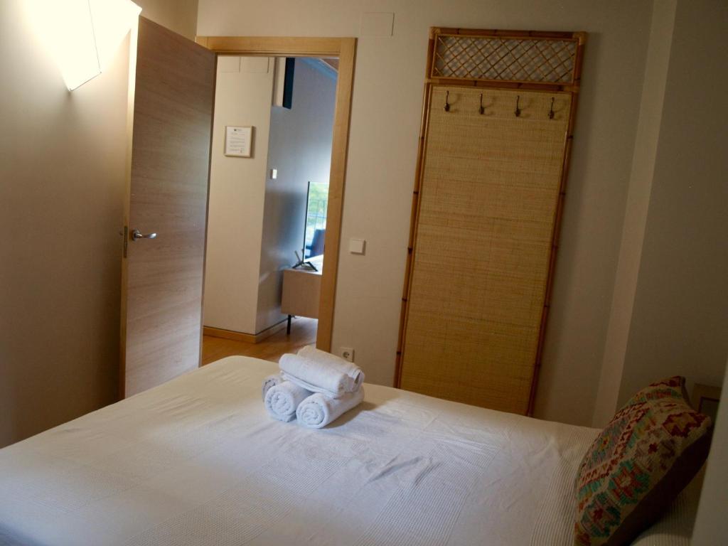 A bed or beds in a room at El Corral de Baró