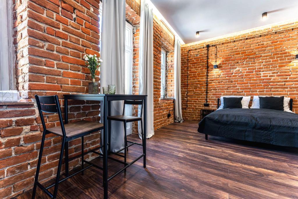 Giường trong phòng chung tại Wasz Metraż Lubartowska