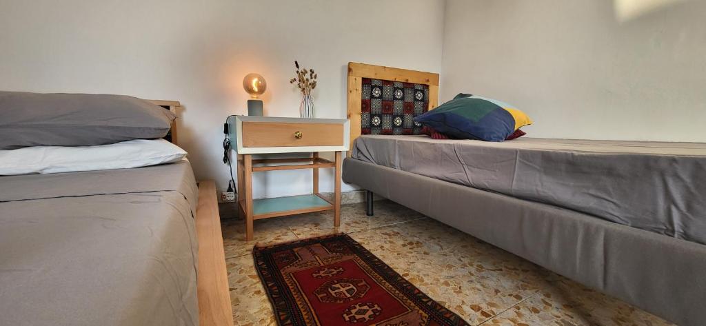 A bed or beds in a room at Casa Maravì