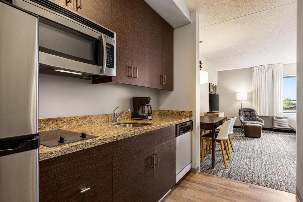 a kitchen with a sink and a microwave at TownePlace Suites by Marriott Harrisburg West/Mechanicsburg in Mechanicsburg