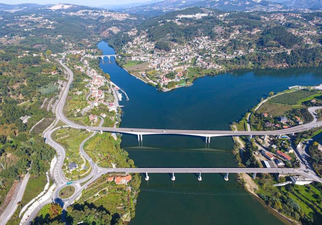 an aerial view of a bridge over a lake at Burguesinha AL Entre-os-Rios in Entre-os-Rios