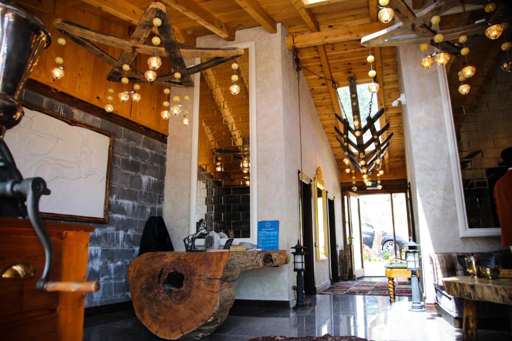 a room with a wooden sink in a building at MAVİ AT HOTEL Blue Horse in Gümüşdere