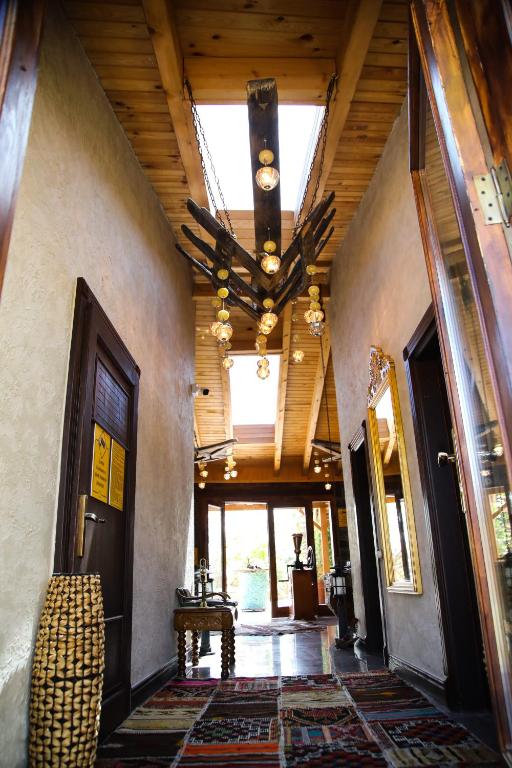 a hallway of a house with a ceiling at MAVİ AT HOTEL Blue Horse in Gümüşdere
