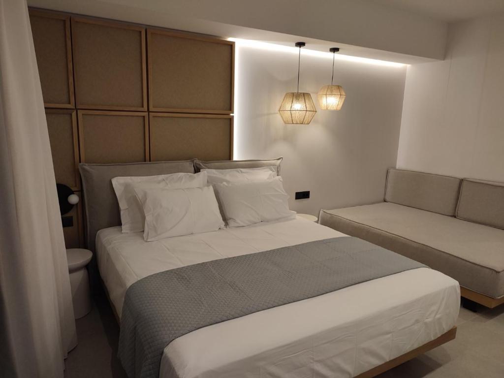 Postel nebo postele na pokoji v ubytování Ammos Paleochora Hotel