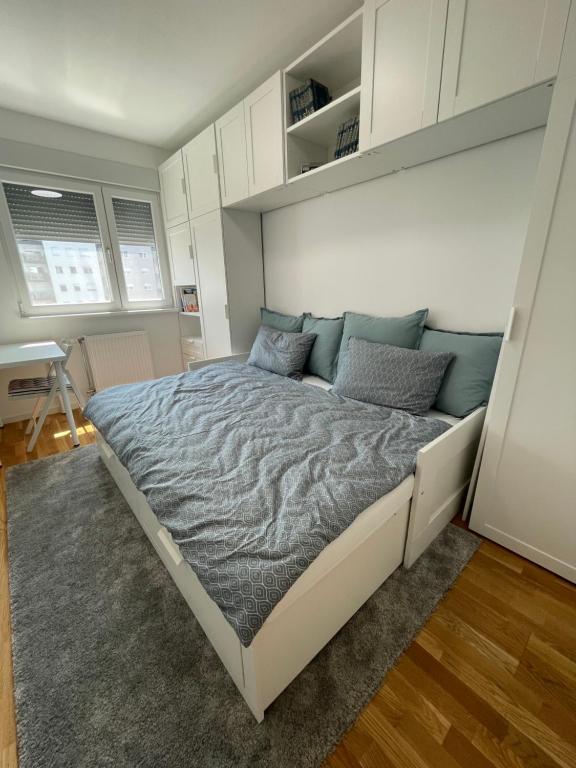 a bedroom with a large bed in a room at Apartment Park in Novi Sad