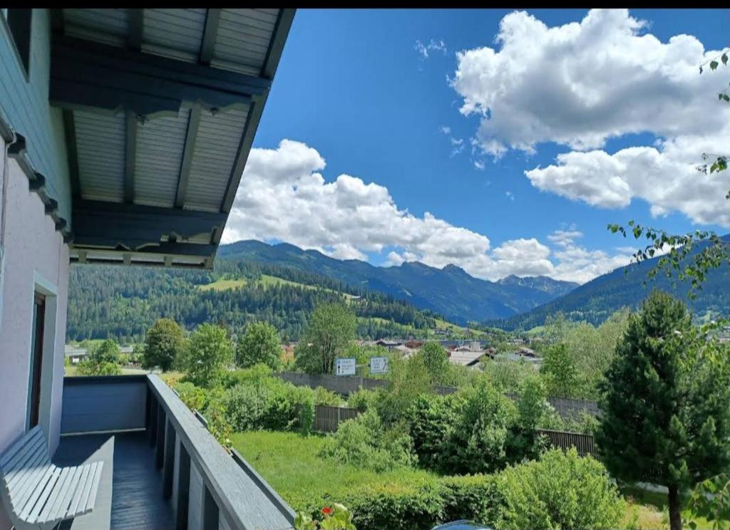 a balcony of a house with a view of mountains at Mani‘s Appartements in Radstadt