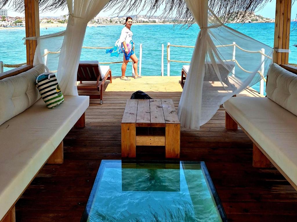 a woman standing on the deck of a boat at Boheme B6 Sunrise Beach in Kalecik