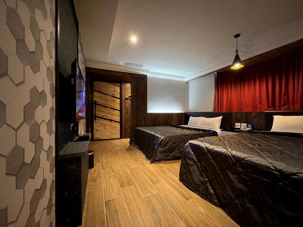 Postel nebo postele na pokoji v ubytování King & Princess Motel - Rende