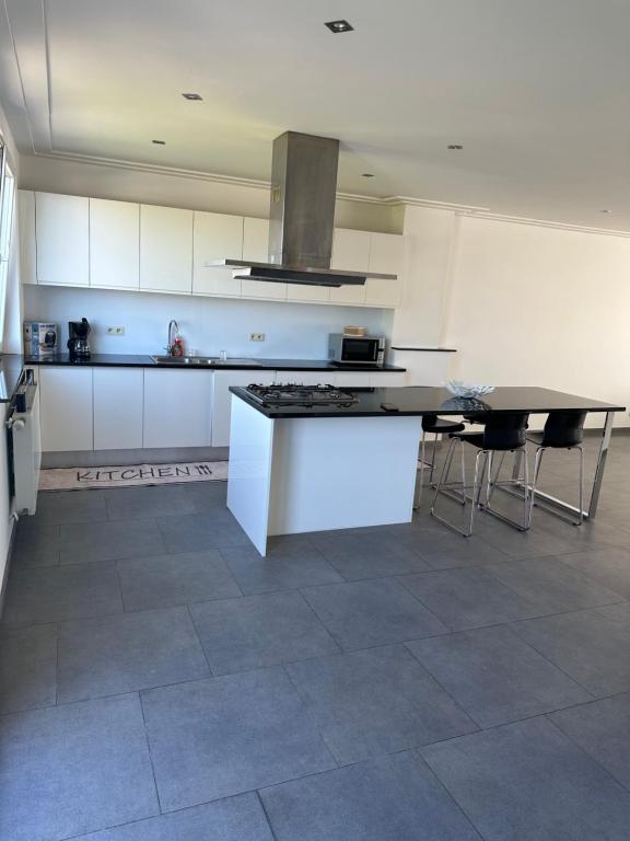 Kuchyň nebo kuchyňský kout v ubytování Appartamnet 3 bedroom + living