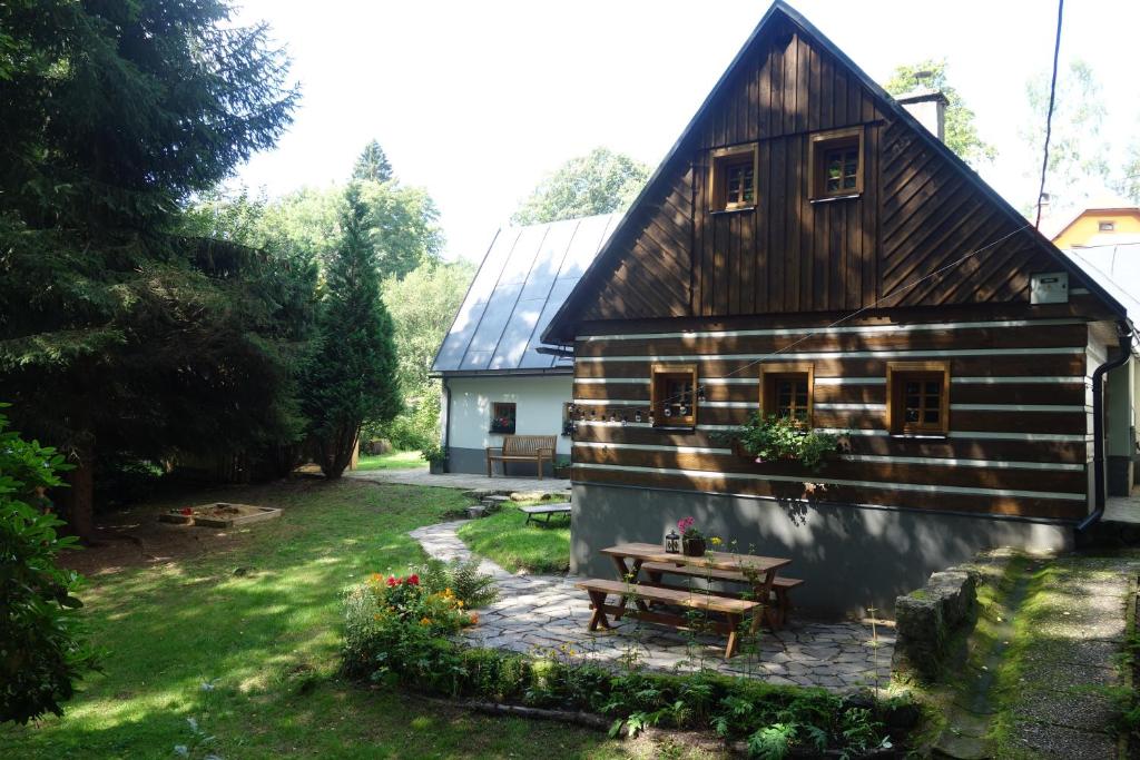 a house with a picnic table in front of it at Rábenka in Janov nad Nisou