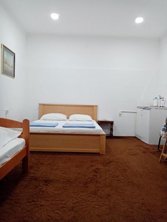 Postel nebo postele na pokoji v ubytování Apartman Dragulj 2