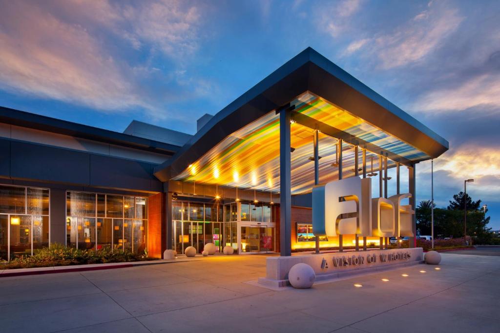 a building with a sign in front of it at Aloft San Francisco Airport in Millbrae