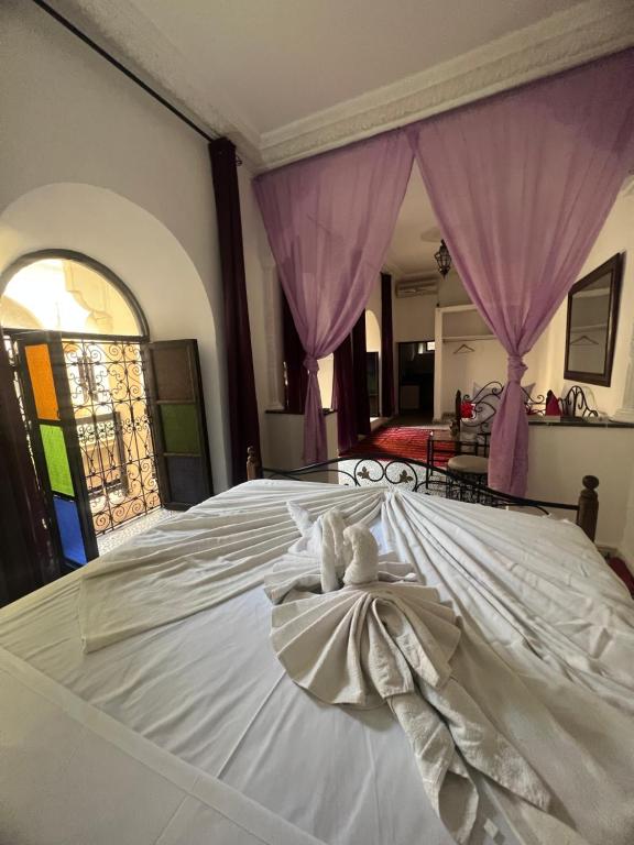 Postel nebo postele na pokoji v ubytování Riad Ago