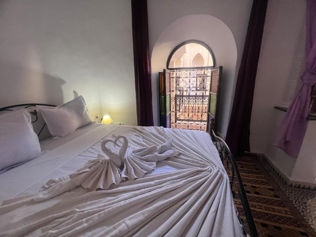 Postel nebo postele na pokoji v ubytování Riad Ago