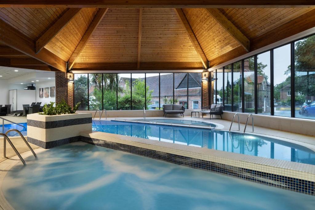 a large swimming pool with a large building at Delta Hotels by Marriott York in York