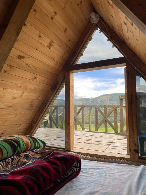 Postel nebo postele na pokoji v ubytování Mini Cabaña Roca Glamping