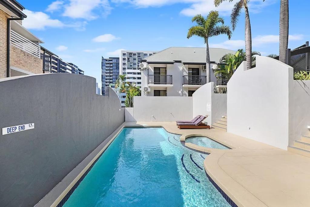a swimming pool in the backyard of a house at Parkview Apartments in Brisbane