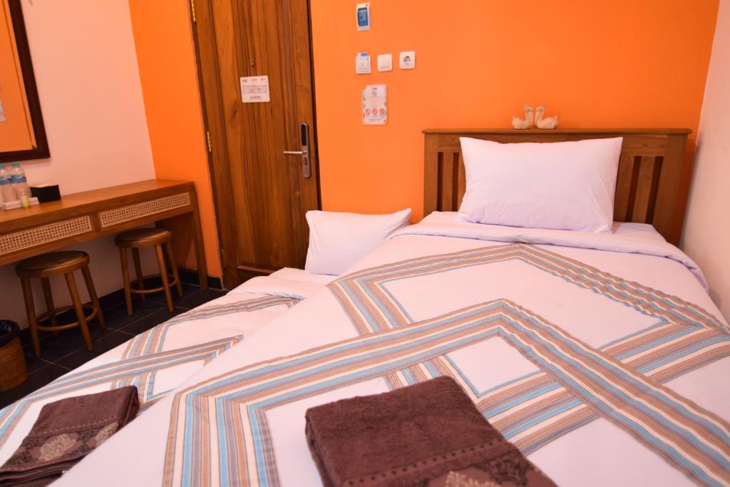 Postel nebo postele na pokoji v ubytování The Cabin Hotel Mantrijeron