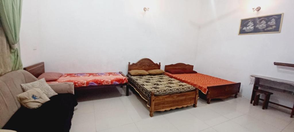 Postel nebo postele na pokoji v ubytování 20 House Villa