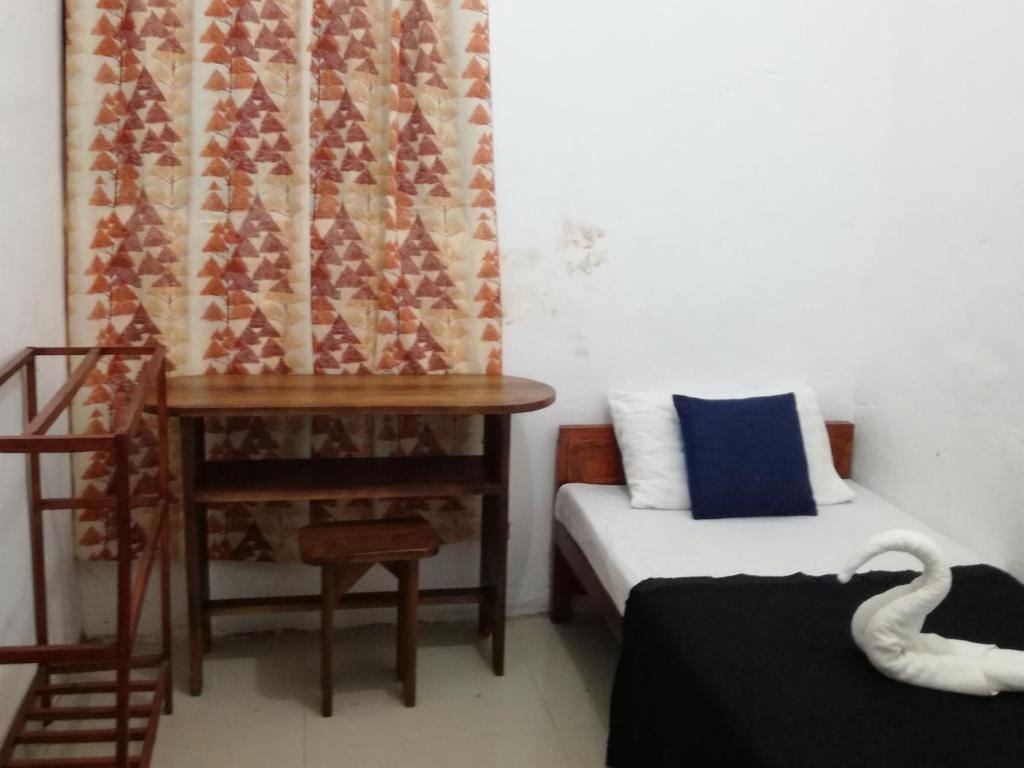 Postel nebo postele na pokoji v ubytování 20 House Arugam