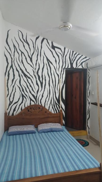 Postel nebo postele na pokoji v ubytování 20 House Arugam