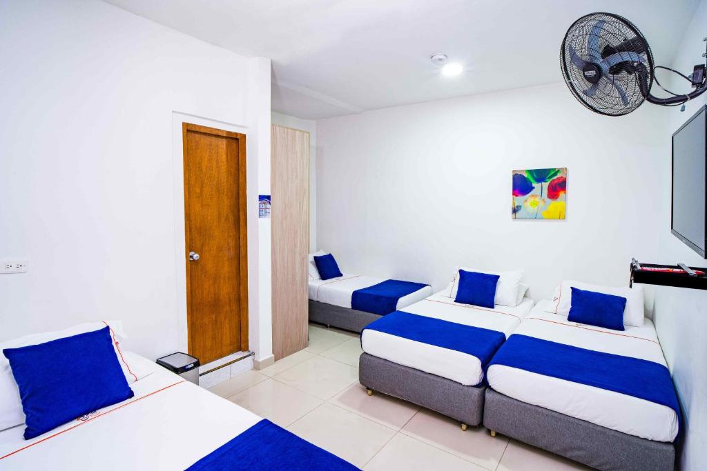 Postel nebo postele na pokoji v ubytování Hotel Casa 10