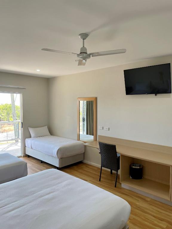 Postel nebo postele na pokoji v ubytování Club Tropical Resort Darwin
