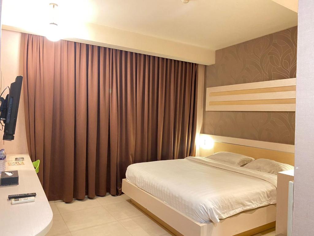 Postel nebo postele na pokoji v ubytování Classie Hotel