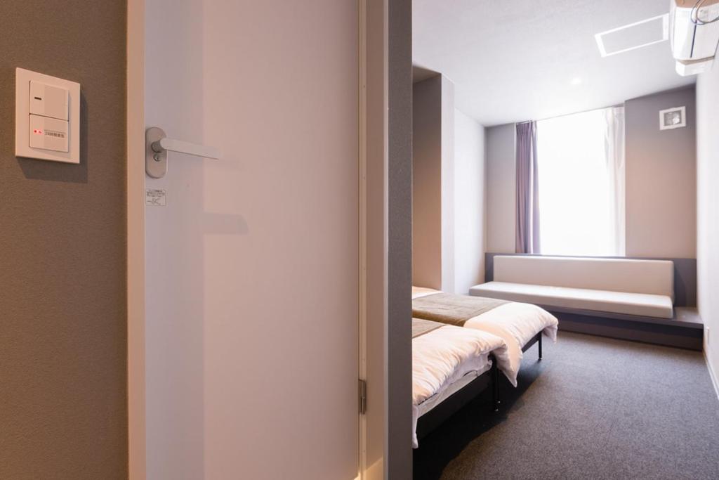 Postel nebo postele na pokoji v ubytování BON Hostel