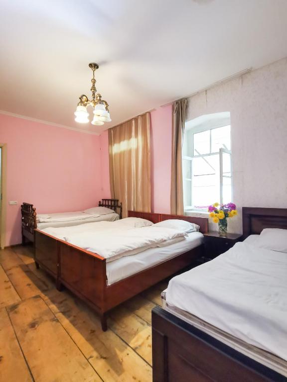 Postel nebo postele na pokoji v ubytování Guest House LALI