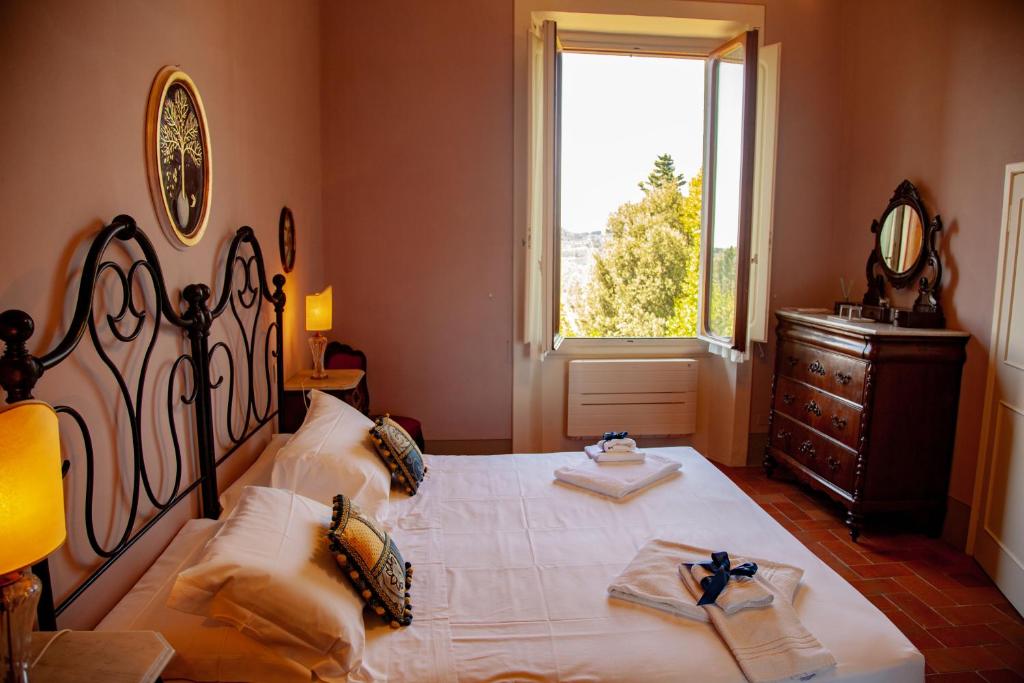 Posteľ alebo postele v izbe v ubytovaní Agriturismo Villa Ulivello in Chianti