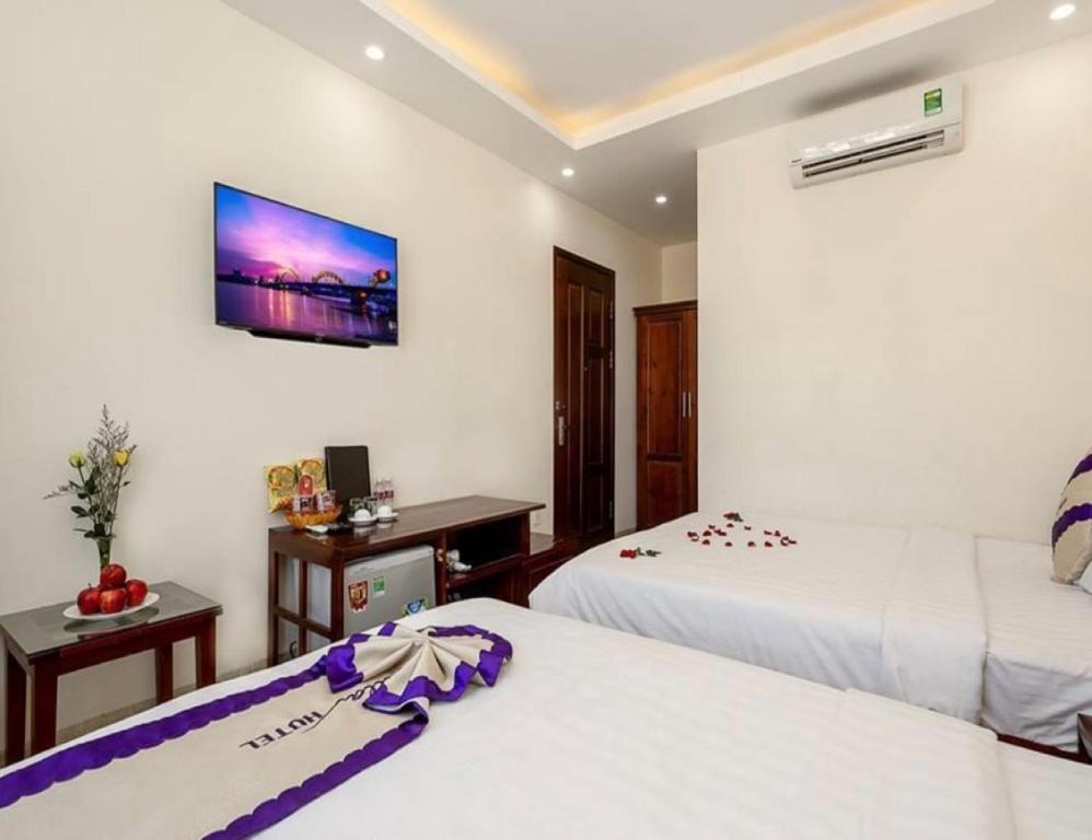 Postel nebo postele na pokoji v ubytování T Y Hotel