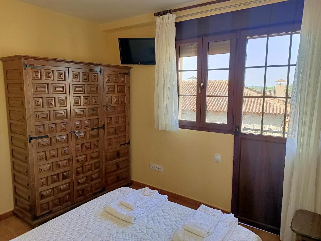 Postel nebo postele na pokoji v ubytování Hotel Rural Valle del Tuejar
