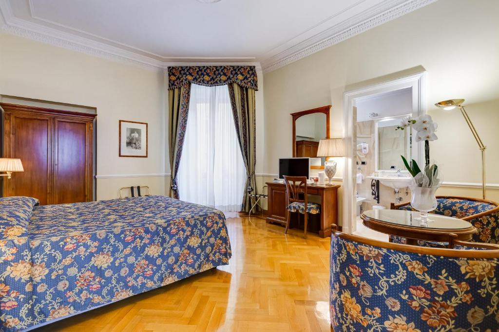Voodi või voodid majutusasutuse Hotel Cellini toas