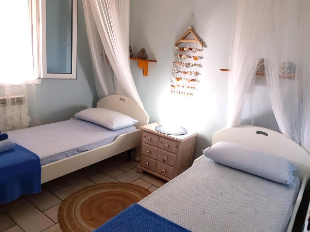 Postel nebo postele na pokoji v ubytování Korés House