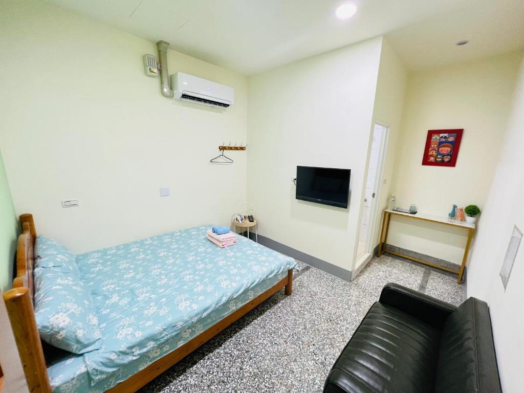TV a/nebo společenská místnost v ubytování Xingang Ping An B&B