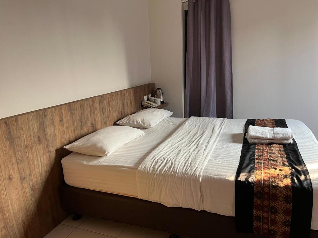 Postel nebo postele na pokoji v ubytování CVS The Hotel