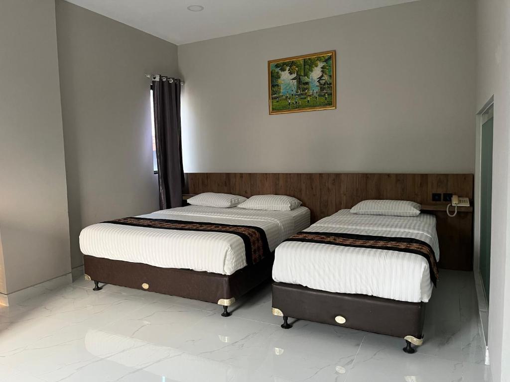 Postel nebo postele na pokoji v ubytování CVS The Hotel