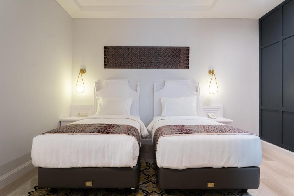 Postel nebo postele na pokoji v ubytování The Difan Hotel