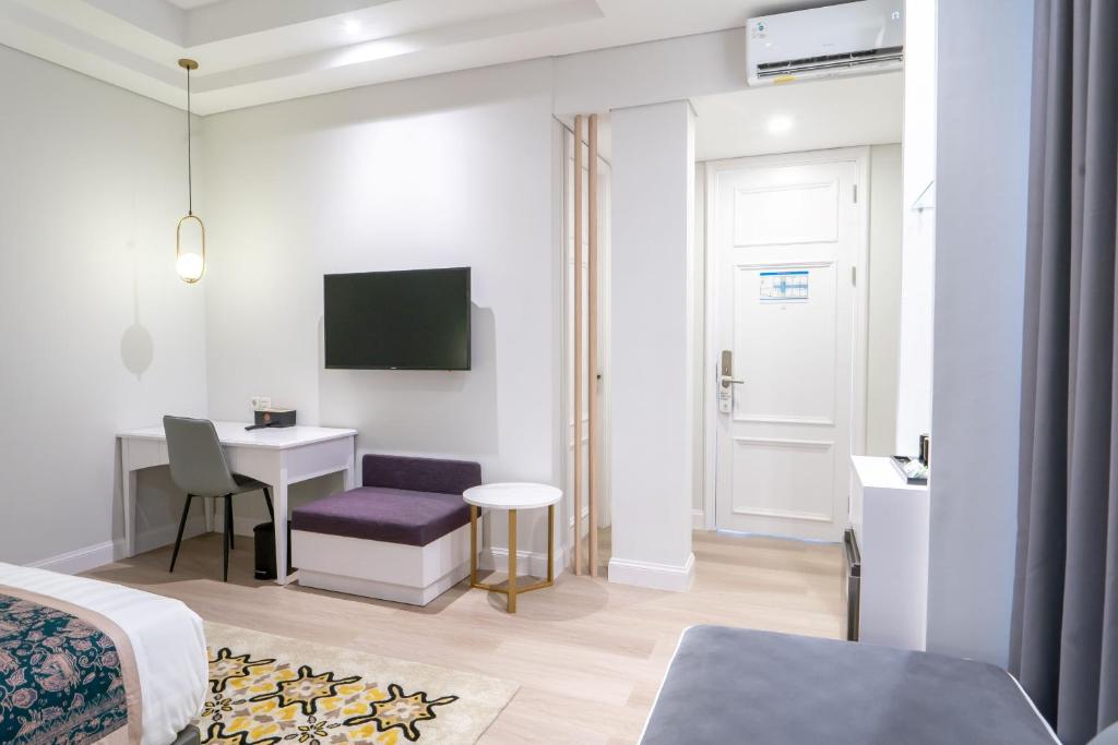 TV a/nebo společenská místnost v ubytování The Difan Hotel