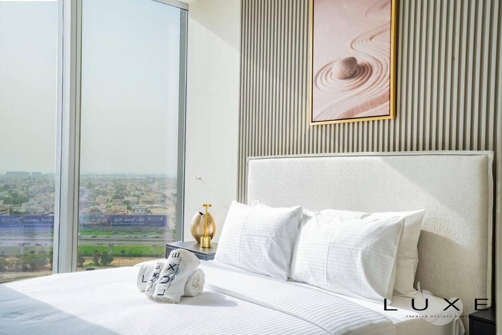 Postel nebo postele na pokoji v ubytování Luxe - Stylish 1 Bedroom Near Burj Khalifa