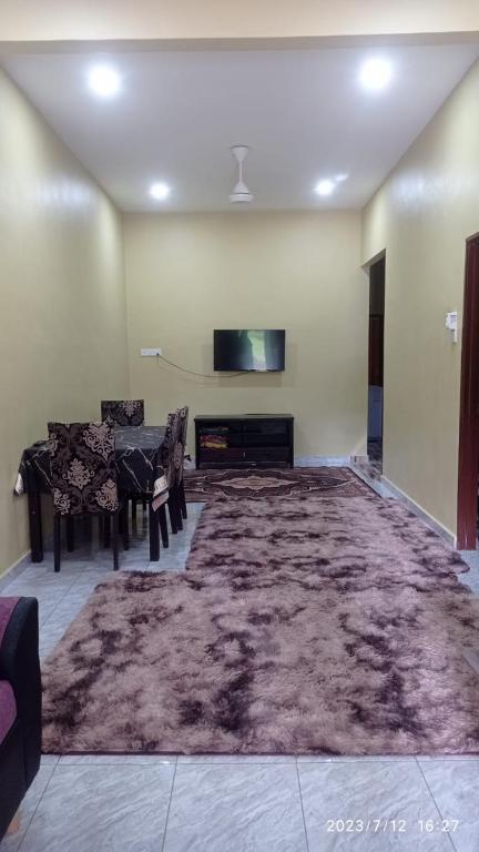 TV a/nebo společenská místnost v ubytování homestay jalan baru sg duri