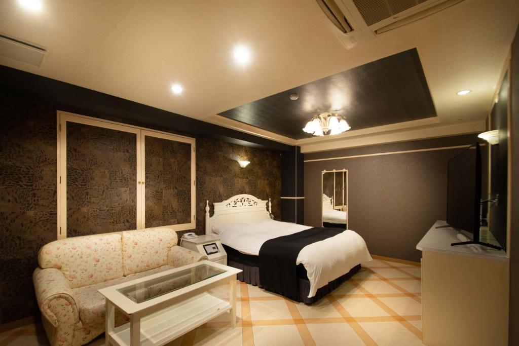 En eller flere senger på et rom på Hotel M
