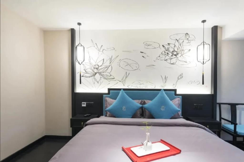 Postel nebo postele na pokoji v ubytování Gongxili - Chujian Hotel