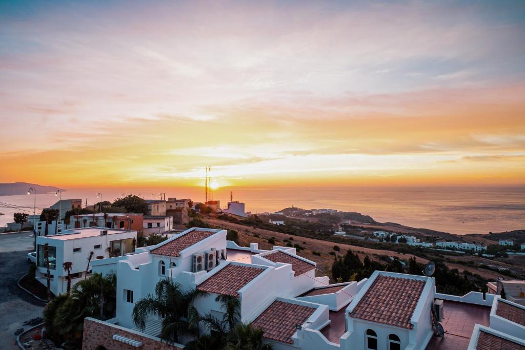 an aerial view of a city at sunset at Dar Mraha in Tangier