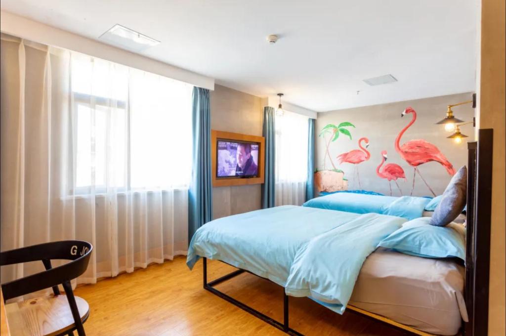 Postel nebo postele na pokoji v ubytování Gongxili - Chujian Hotel