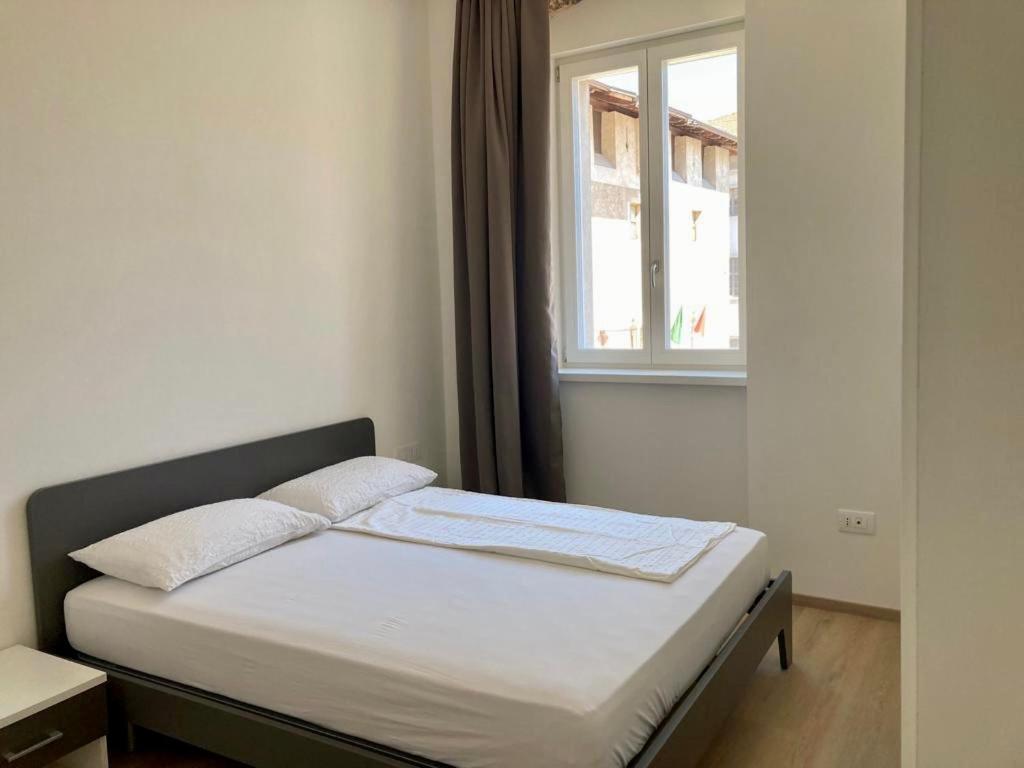 Postel nebo postele na pokoji v ubytování Al Palazzo