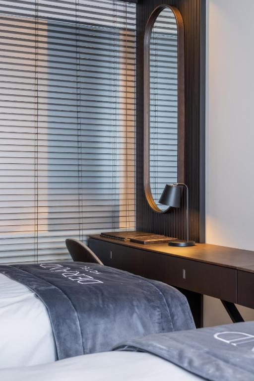 Postel nebo postele na pokoji v ubytování Derand Hotel